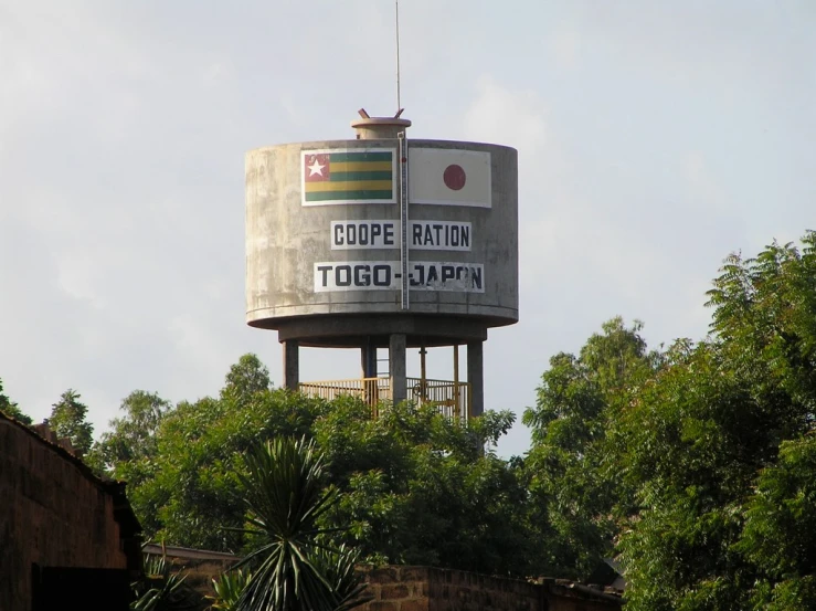 an old and very rusted water tower in the city