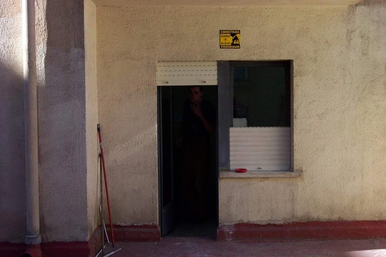 a doorway with a sign that says stop at the entrance