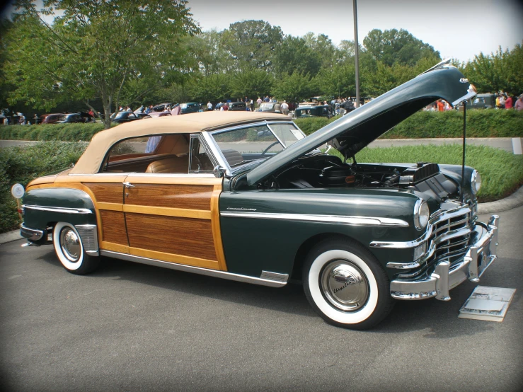 an old, vintage car has been parked for a show