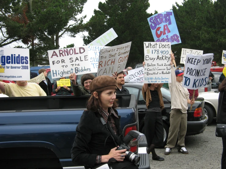 the people are protesting in front of the truck