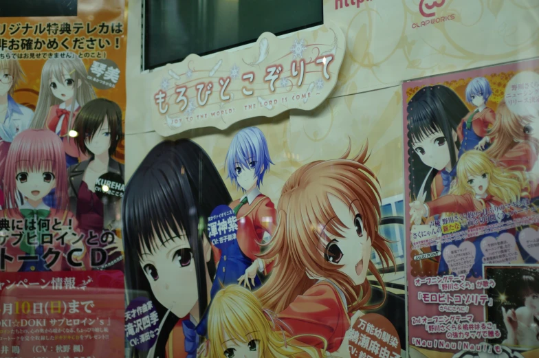 some colorful signs advertise anime characters in front of a building