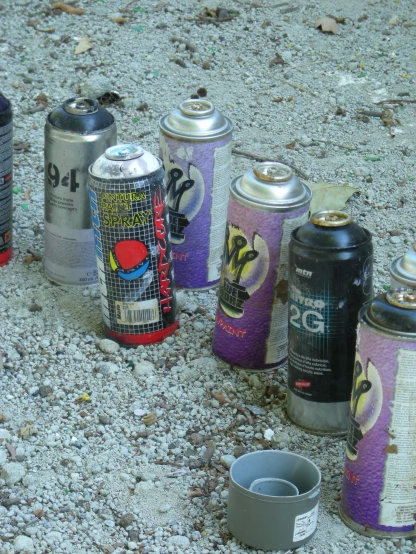 a group of cans sitting in the middle of a street