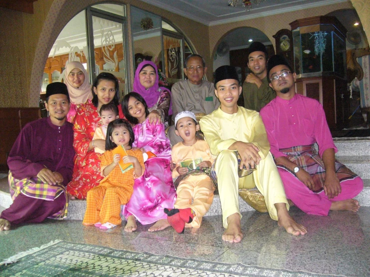 a group of young men and women pose for a po