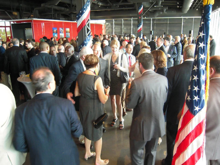 a crowd of people gathered inside of a building