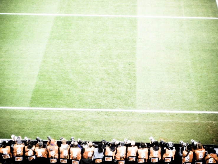 a large field is full of yellow rubber seats with empty seats