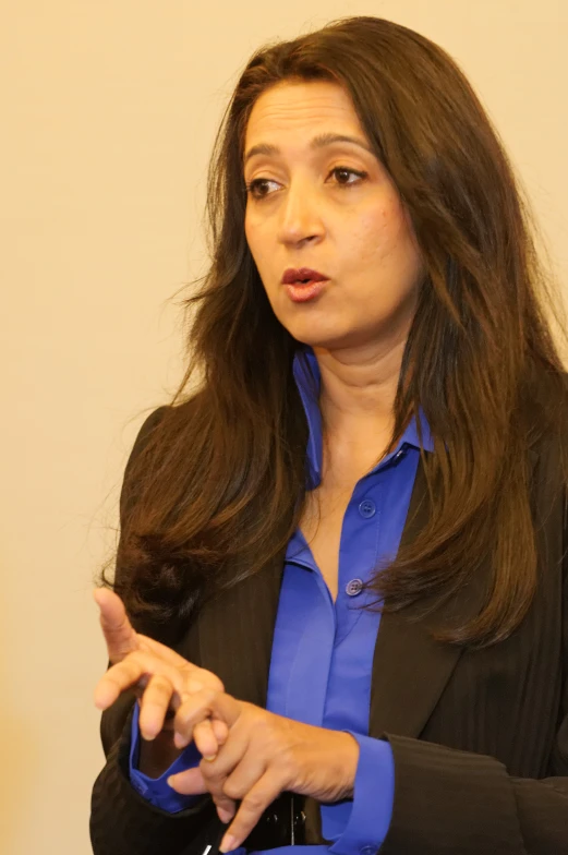 a woman giving a speech in a presentation