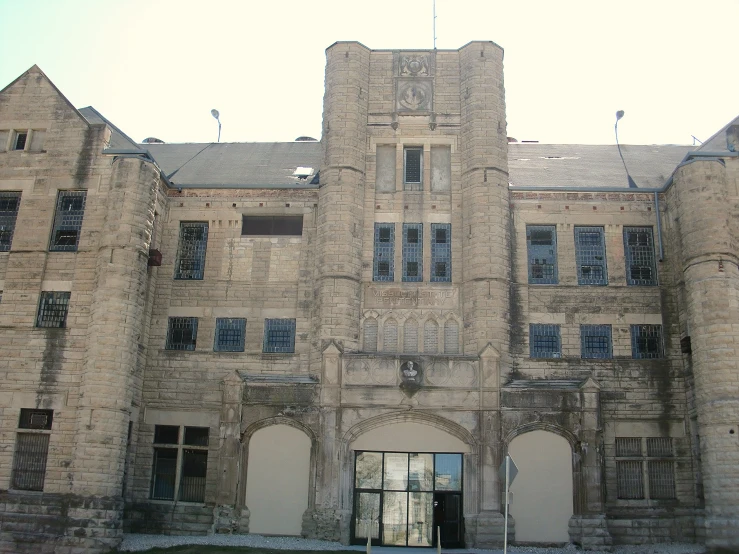 a large building with many windows and several doors