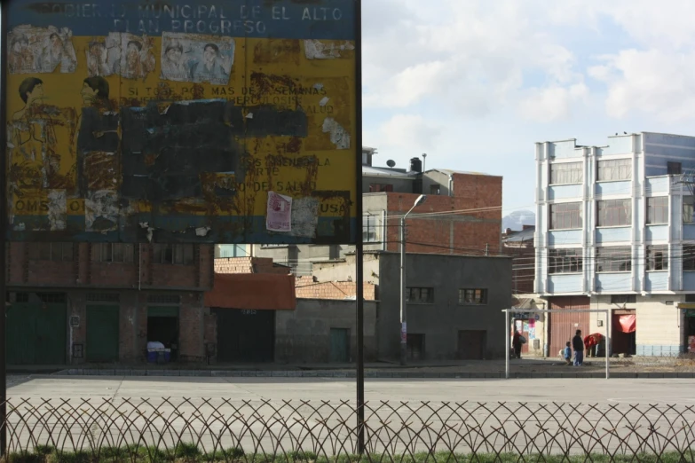 a large building in front of a large metal fence