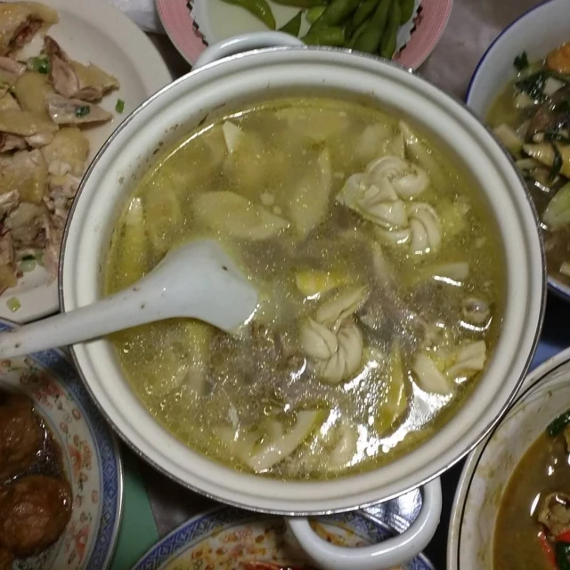 bowls of soup sit together on the table