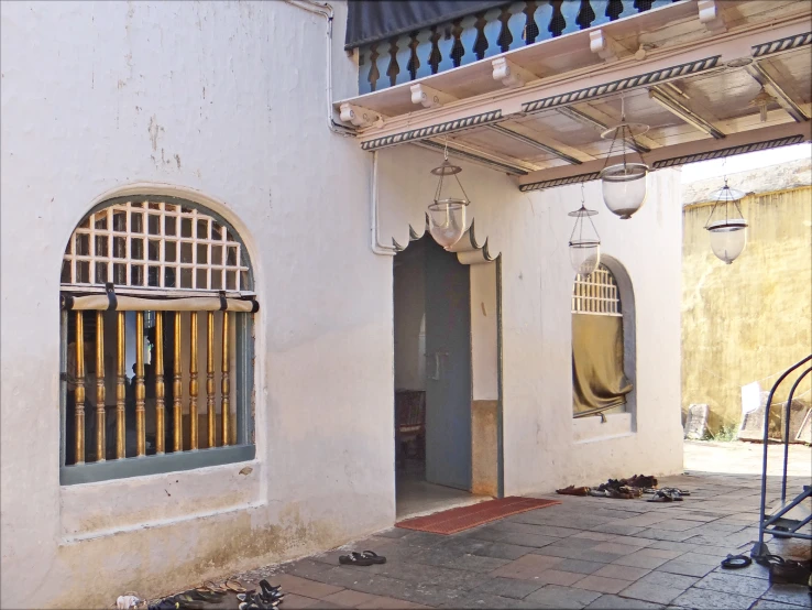 the door to a building with wrought iron bars