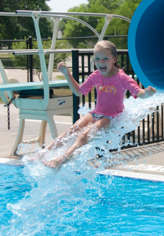 a  sliding down a water slide