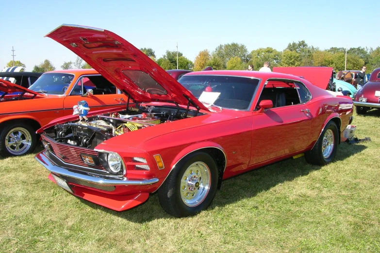 an old ford car with it's hood open