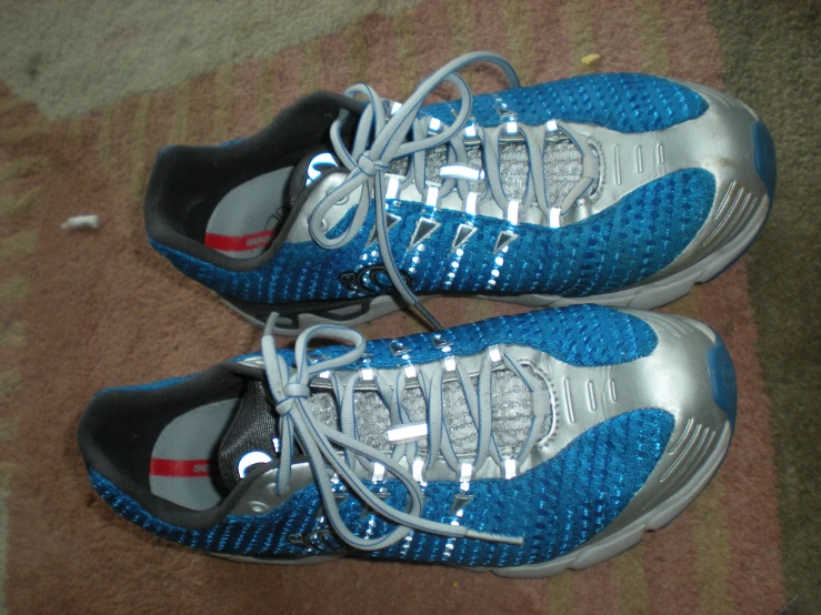 two pairs of sneakers with a blue, grey and white color scheme