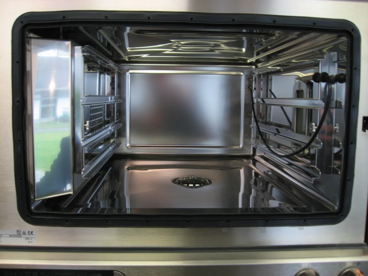 a reflection in an oven door showing its interior