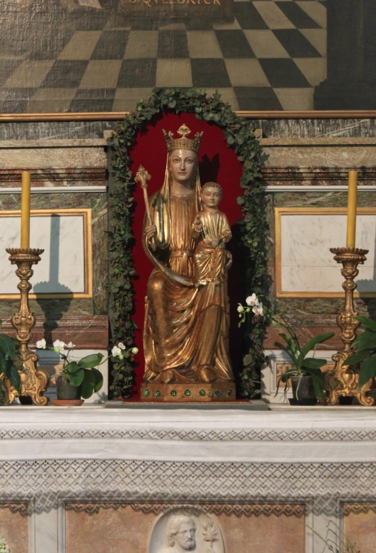 a picture with a golden statue on a mantle