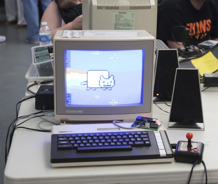 a computer monitor and keyboard sitting on a table