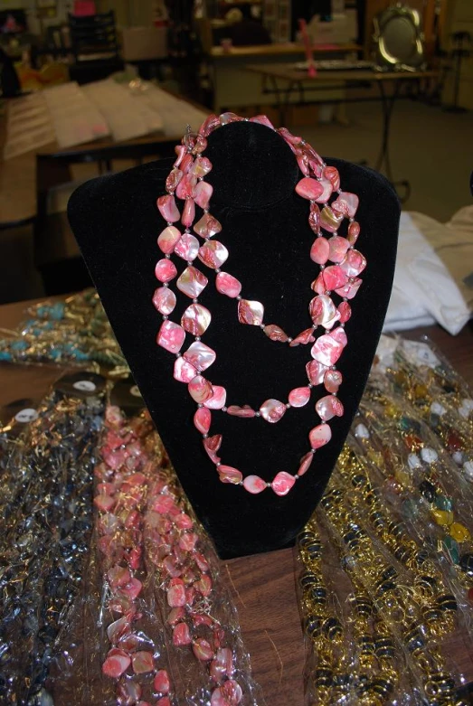 pink jewels sitting on display next to one another