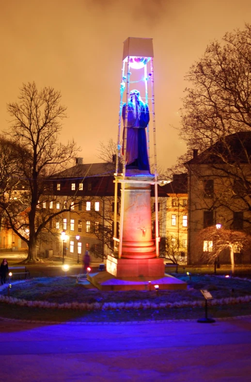 a statue with a man standing in the center