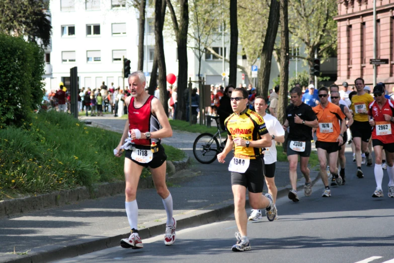 people running in the marathon in shorts and top