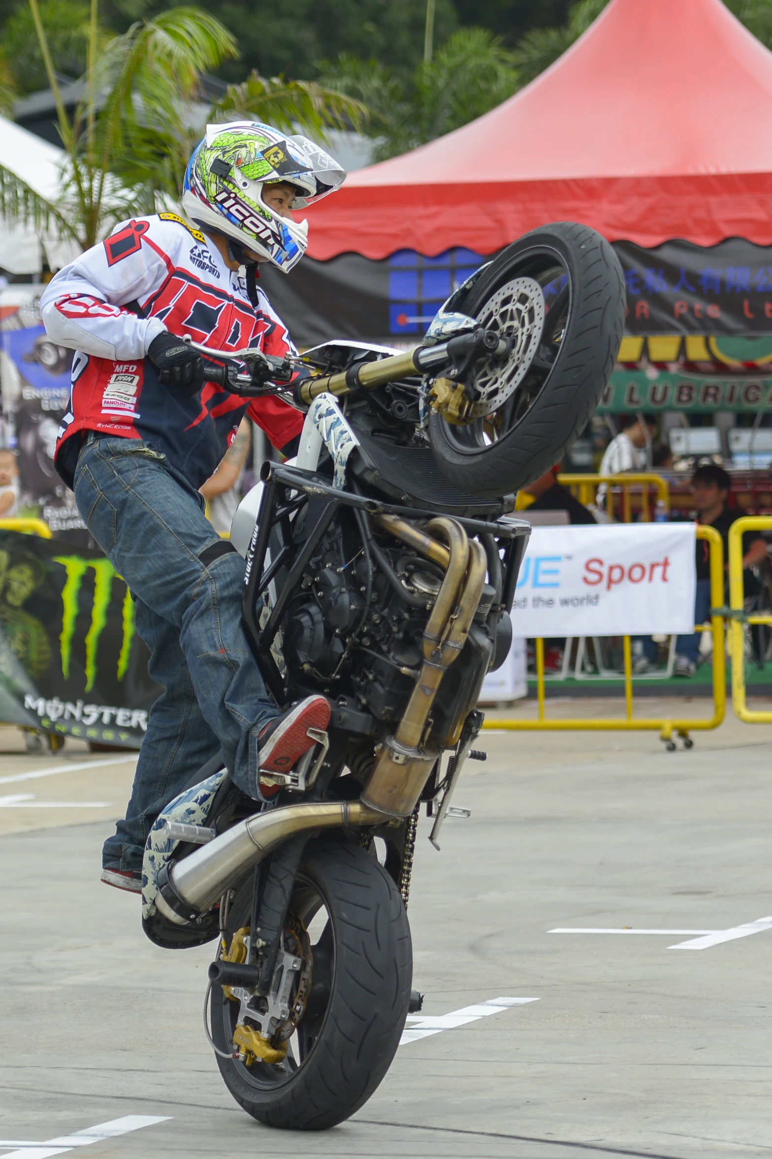 a person on a motorcycle does a trick