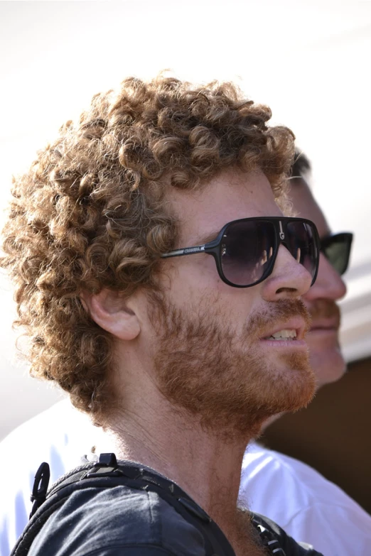 a close up of a person with a jacket and sunglasses