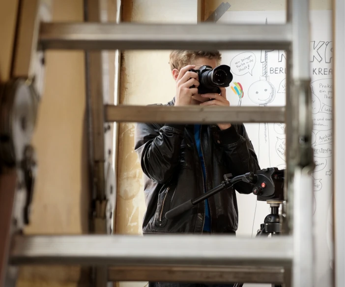 a man taking a po with a camera