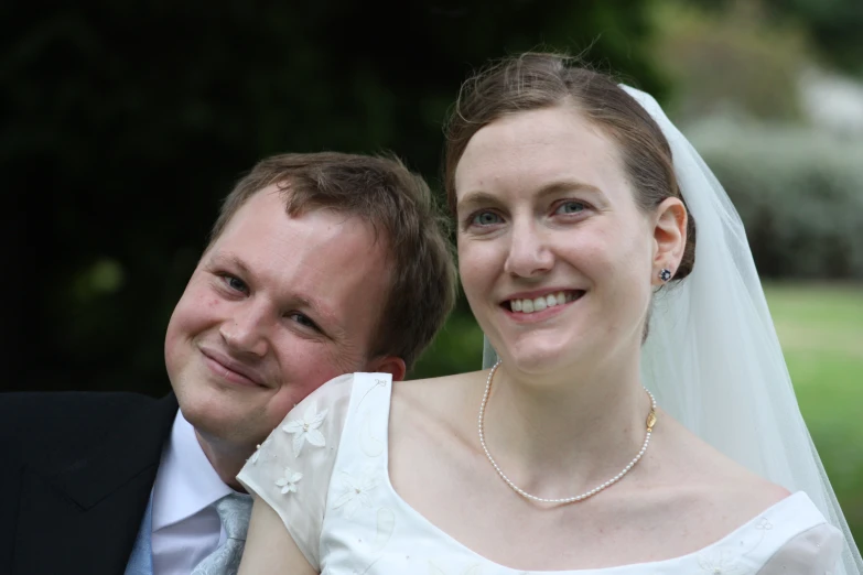 a woman holding a man by her arm