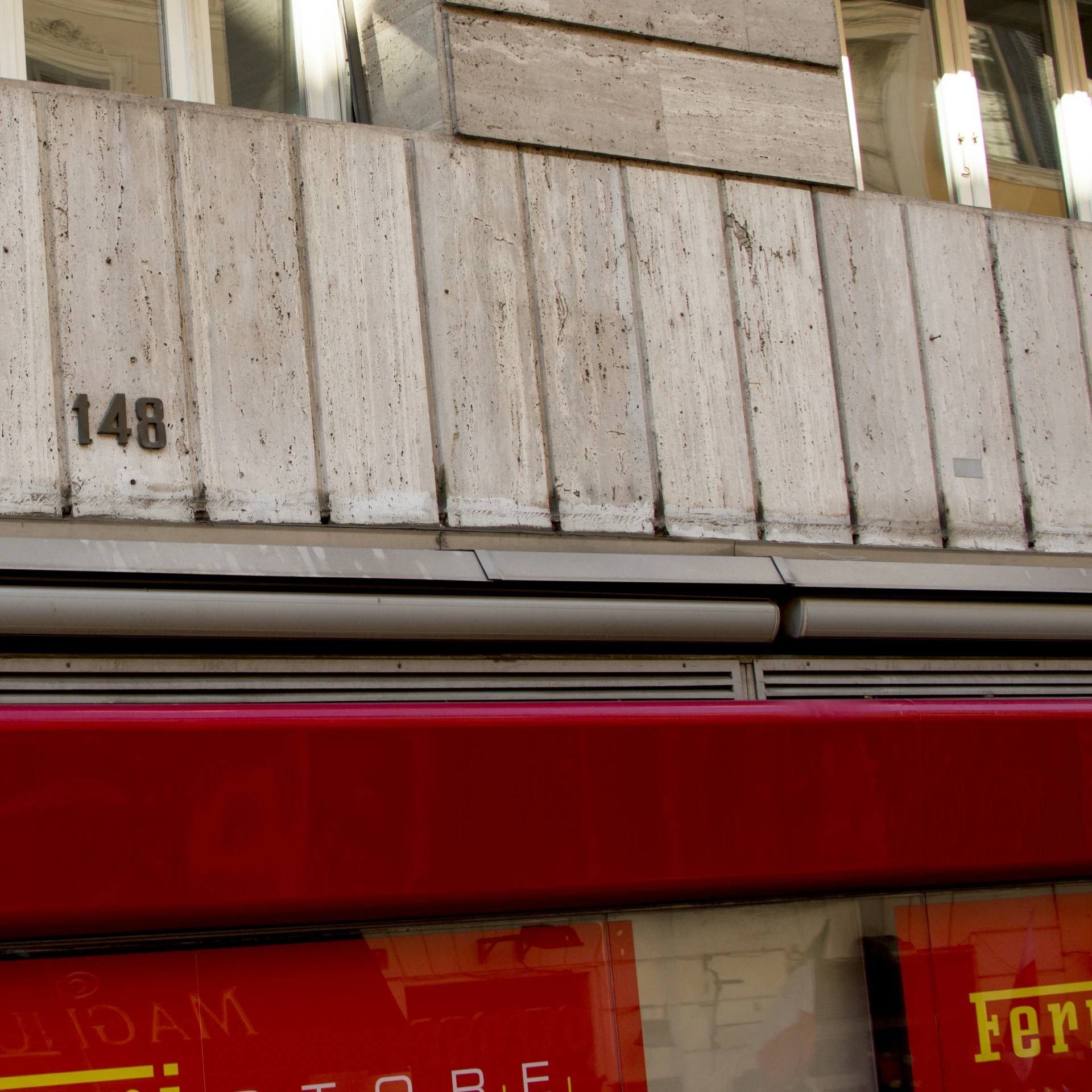 old white siding on an apartment building is red