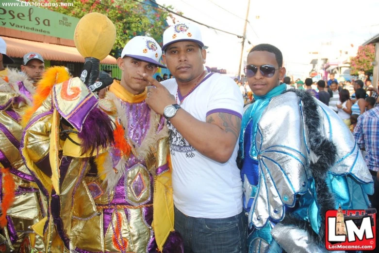 a group of men pose with some colorful costumes