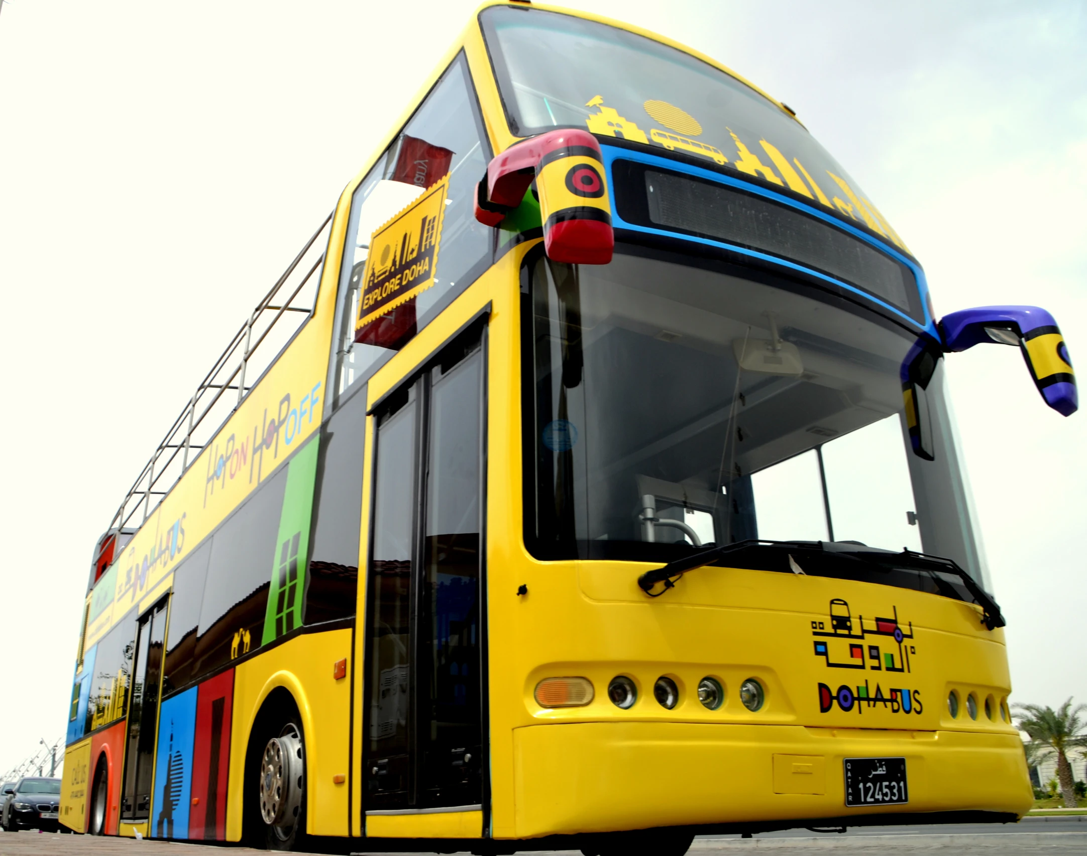 a brightly colored bus that is driving down the street