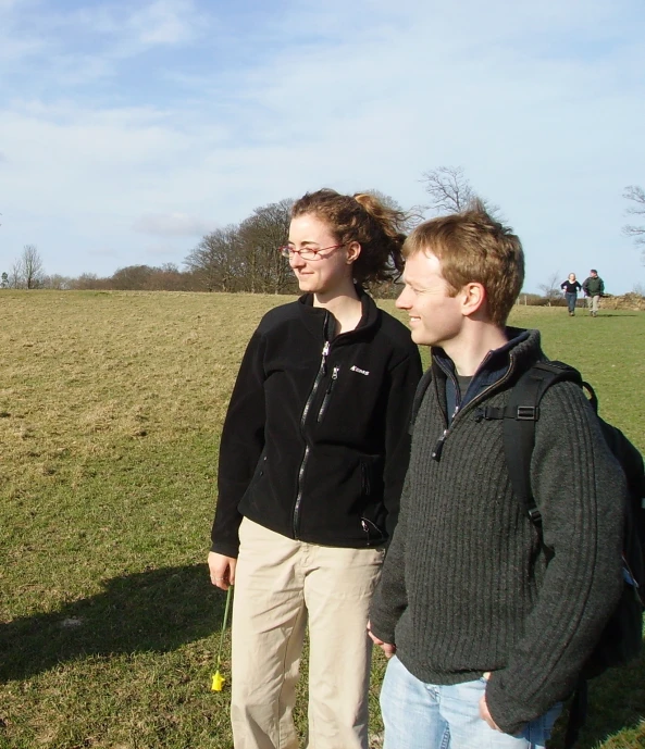 a man and woman are smiling for the camera