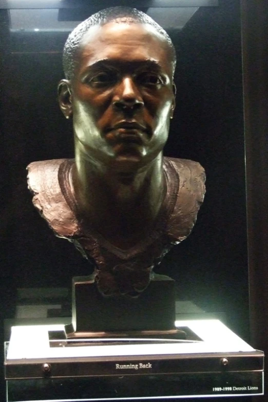 the bust of a man is displayed in a case