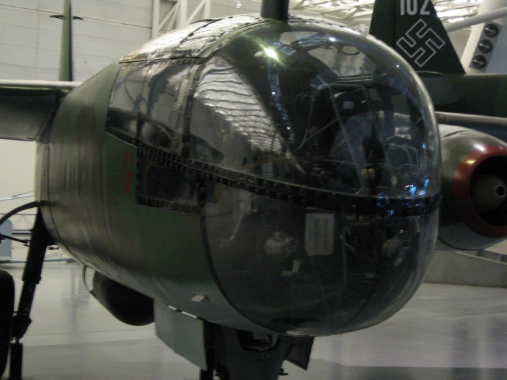 an airplane with the back facing upwards and the front facing backward, displayed on a display