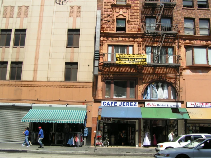 two cars are passing each other in front of a multistory