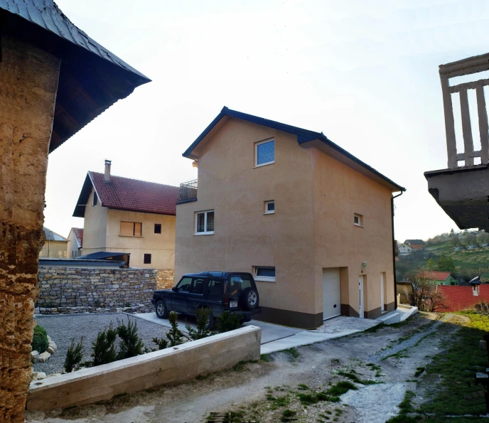 the outside of a two story house and parking lot