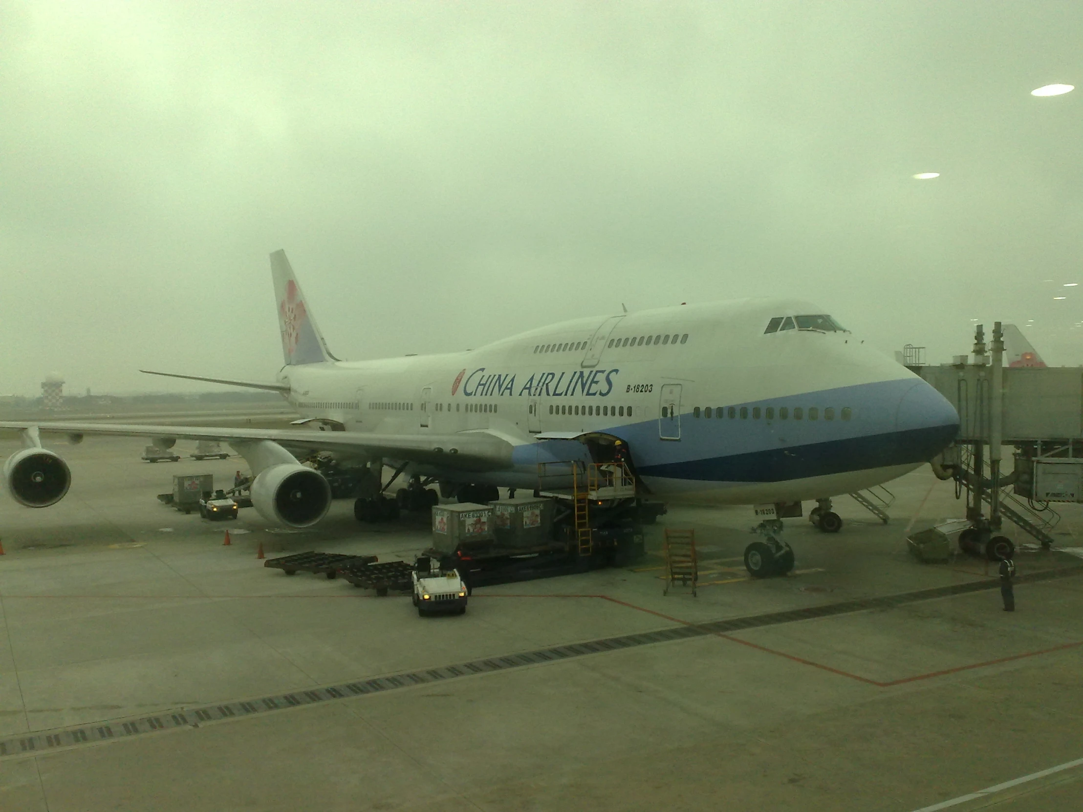 a large passenger jet sitting on top of an airport runway