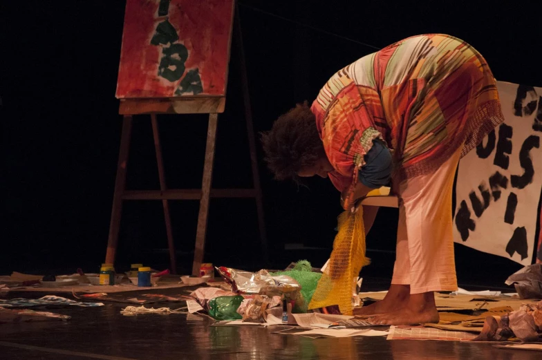 a woman wearing a multi - colored shawl and shoes