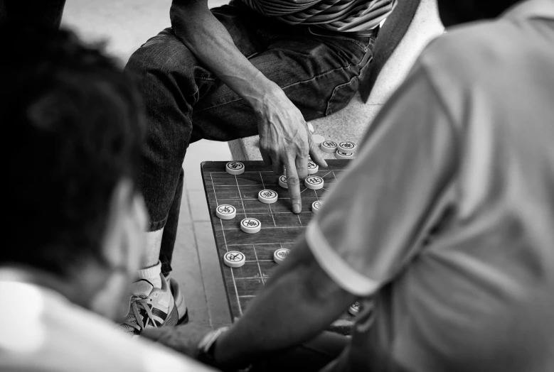two guys playing a game of carrom