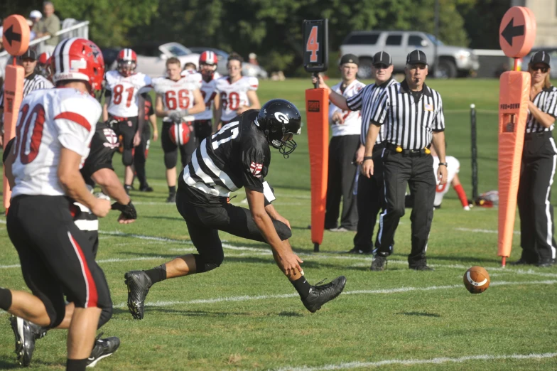 a football player is trying to block the ball