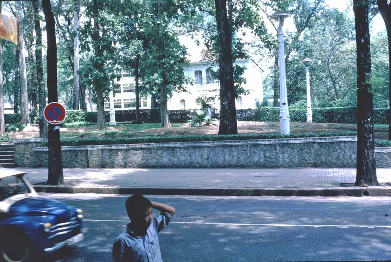 an old man crossing the street in a town