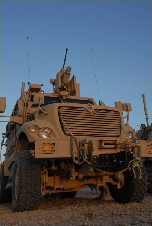 a military truck sits on top of some rocks