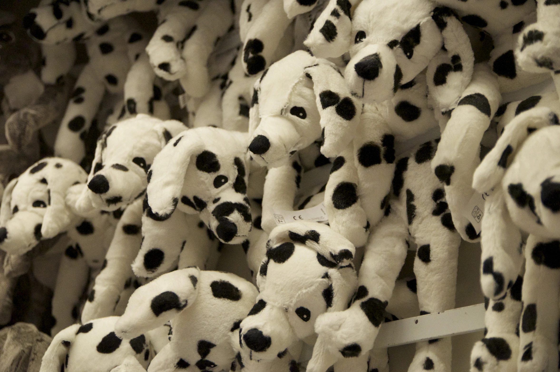 a pile of dalmatian stuffed animals sitting on top of each other