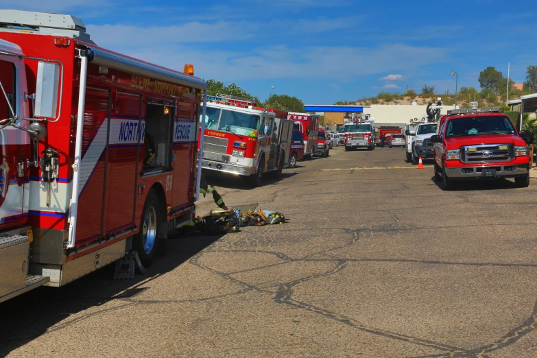 fire trucks parked in a lot next to each other