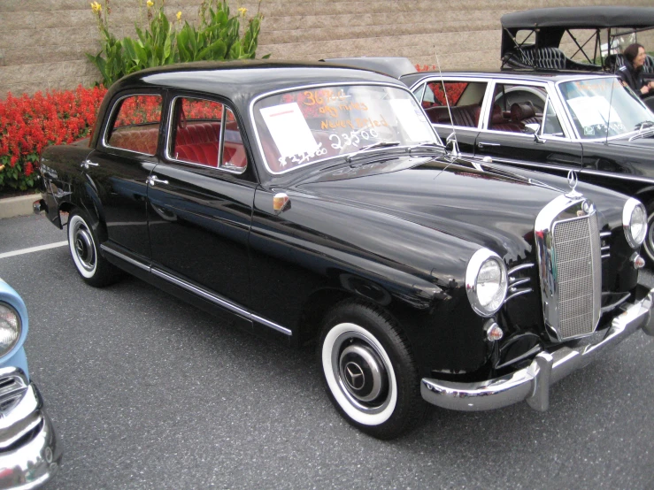 black cars are parked on a paved area