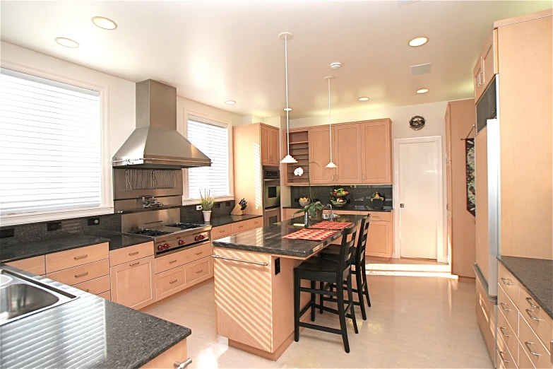 the kitchen with island and counters is very clean