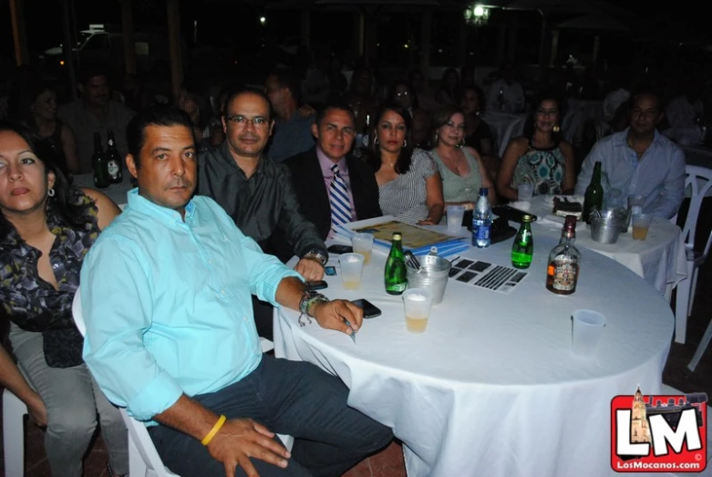 group of people sitting at a table having a discussion