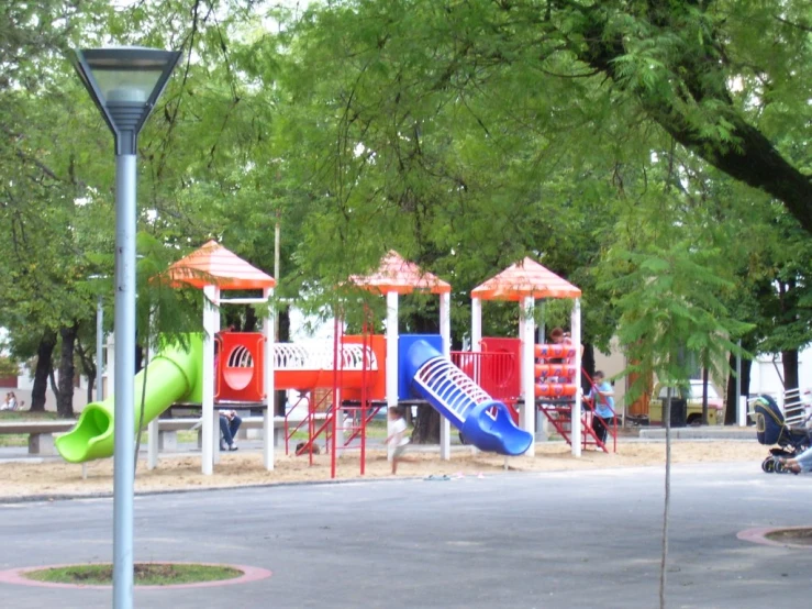 a playground with s's swings, slides and shade sails