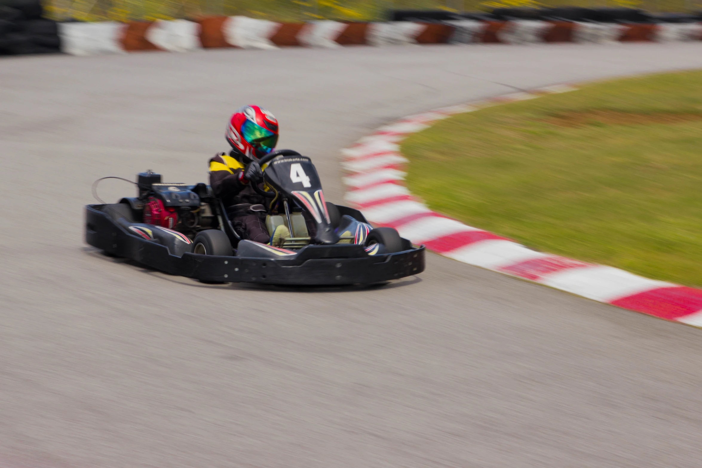 a person driving a go kart down the road