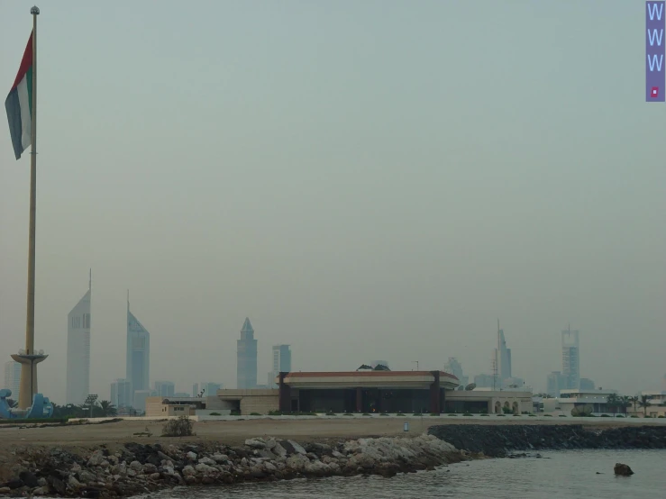 a large body of water sitting below the city skyline