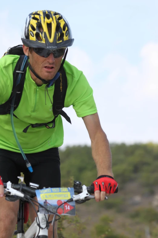 a man riding a bike wearing a helmet and goggles